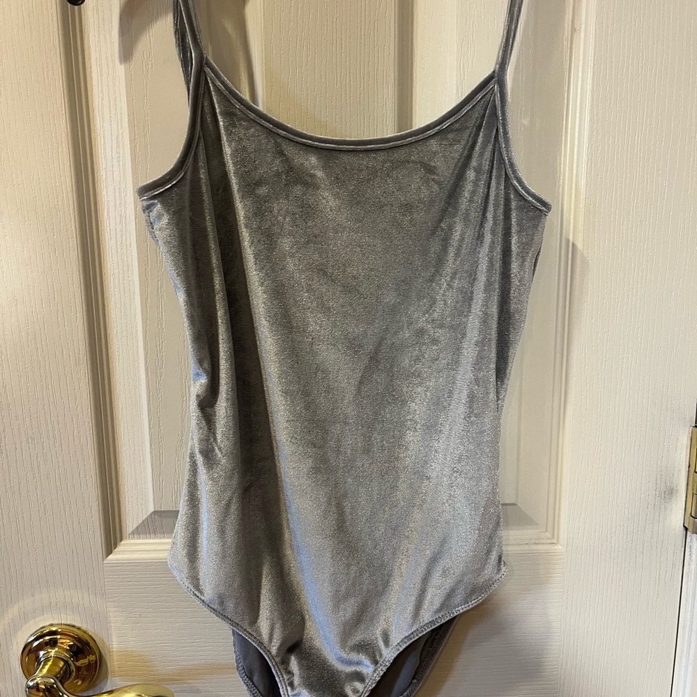 worn a few times velour material size small brand heart and hips body suit